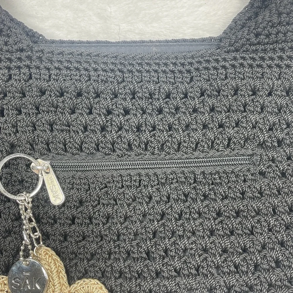 The Sak Black Crochet Shoulder Bag Boho Knit Purse Charm Flower NWOT